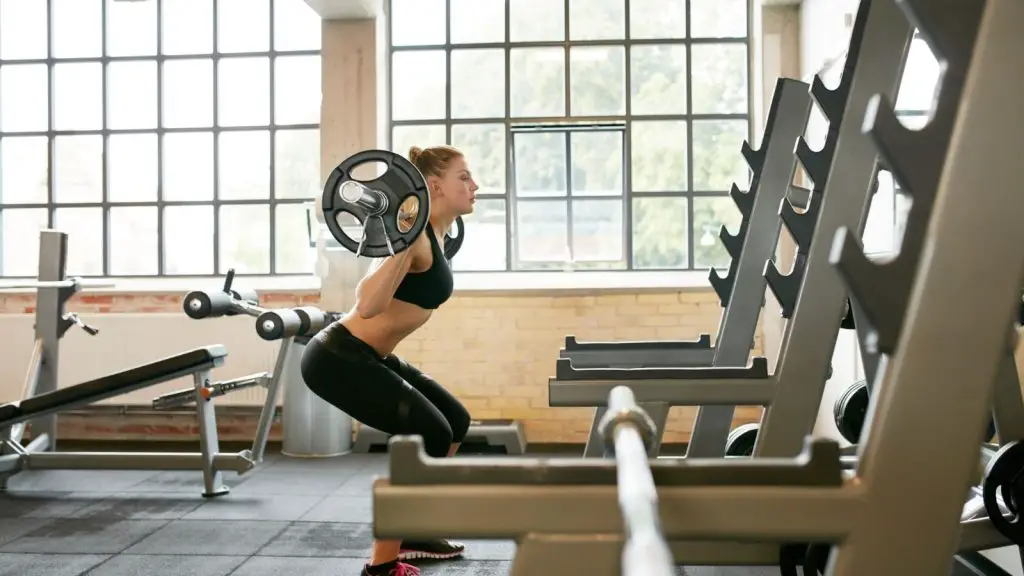 Girl falling back while squatting